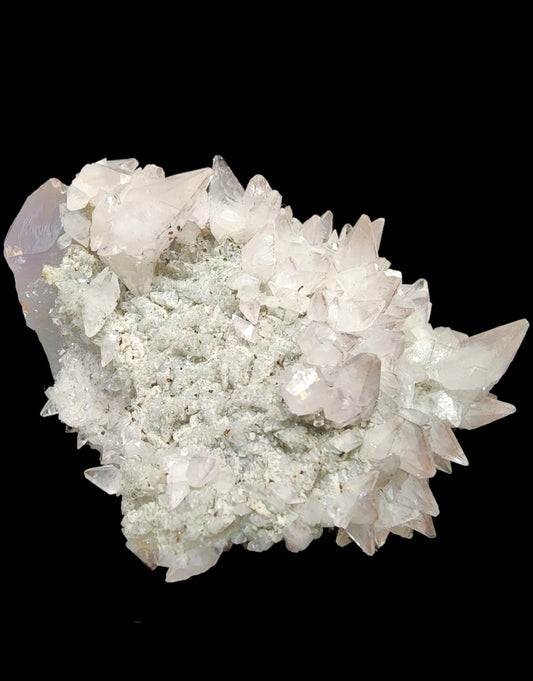 The Crystalary's Quartz v. Amethyst, Calcite (sku 3105) from Tonglushan Mine, features pointed translucent crystals on a textured pale matrix, contrasting with the reflective surfaces of the crystal tips.