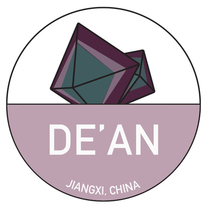 A circular logo featuring two geometric, purple and green crystals reminiscent of a Fluorite Passport hovers above the text "DE'AN." The lower half of the design is filled with light purple color, with "JIANGXI, CHINA" written at the bottom in white letters. The vibrant design of these Chinese Passport Stickers by The Crystalary would make stunning stickers.