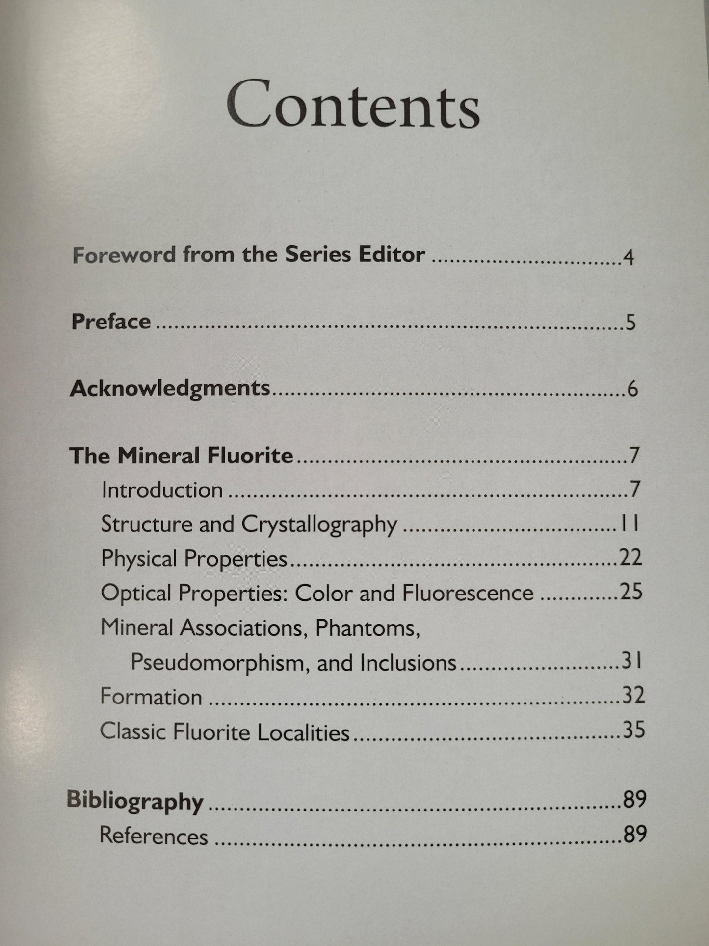 The table of contents from "Collector's Guide to Fluorite" by Arvid Eric Pasto, published by The Crystalary, includes sections for Foreword, Preface, Acknowledgments, and The Mineral Fluorite with various subsections. Also listed are Bibliography and References, all with page numbers indicated next to each section.