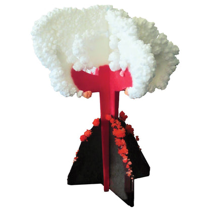 The Crystal Growing Volcano by Copernicus Toys stands upright with white crystalline structures forming a cloud-like shape at the top and red crystallized formations around its base. This craft and science kit captures the magic of crystal growing, with vibrant colors highlighting the intricate formations.