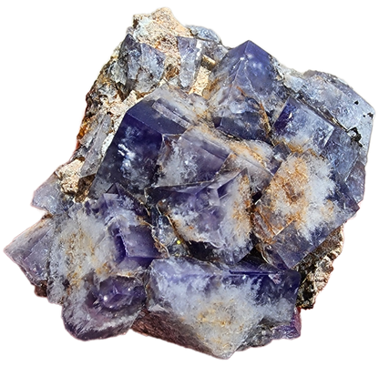 A Fluorite-Milky Way Pocket from Diana Maria Mine, Weardale, Co Durham, UK by The Crystalary features a stunning array of deep to light purple prismatic crystals with transparent clarity and daylight fluorescence. These crystals are set against a rough, earthy matrix background interspersed with patches of white and beige mineral deposits.