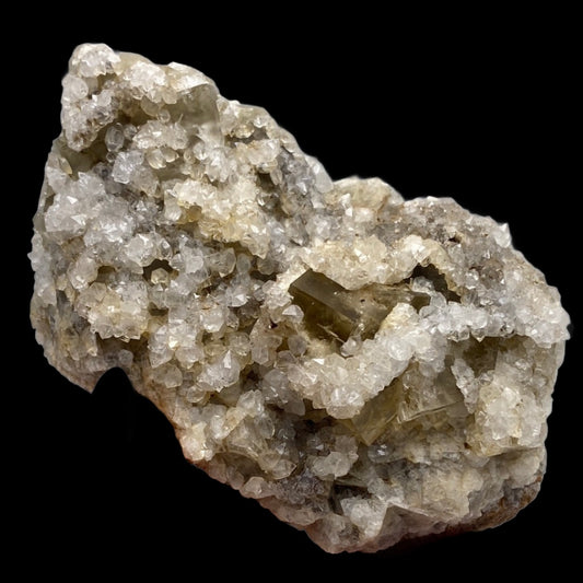 A substantial mineral specimen featuring numerous small, translucent fluorite crystals with a rough texture, primarily white with grayish and yellowish hues. Calcite overgrowths on an altered limestone matrix are visible, set against a solid black background. This piece hails from the Harvest Pocket, Lady Annabella in Co Durham, UK and is offered by The Crystalary under the product name Fluorite, Quartz- Harvest Pocket.