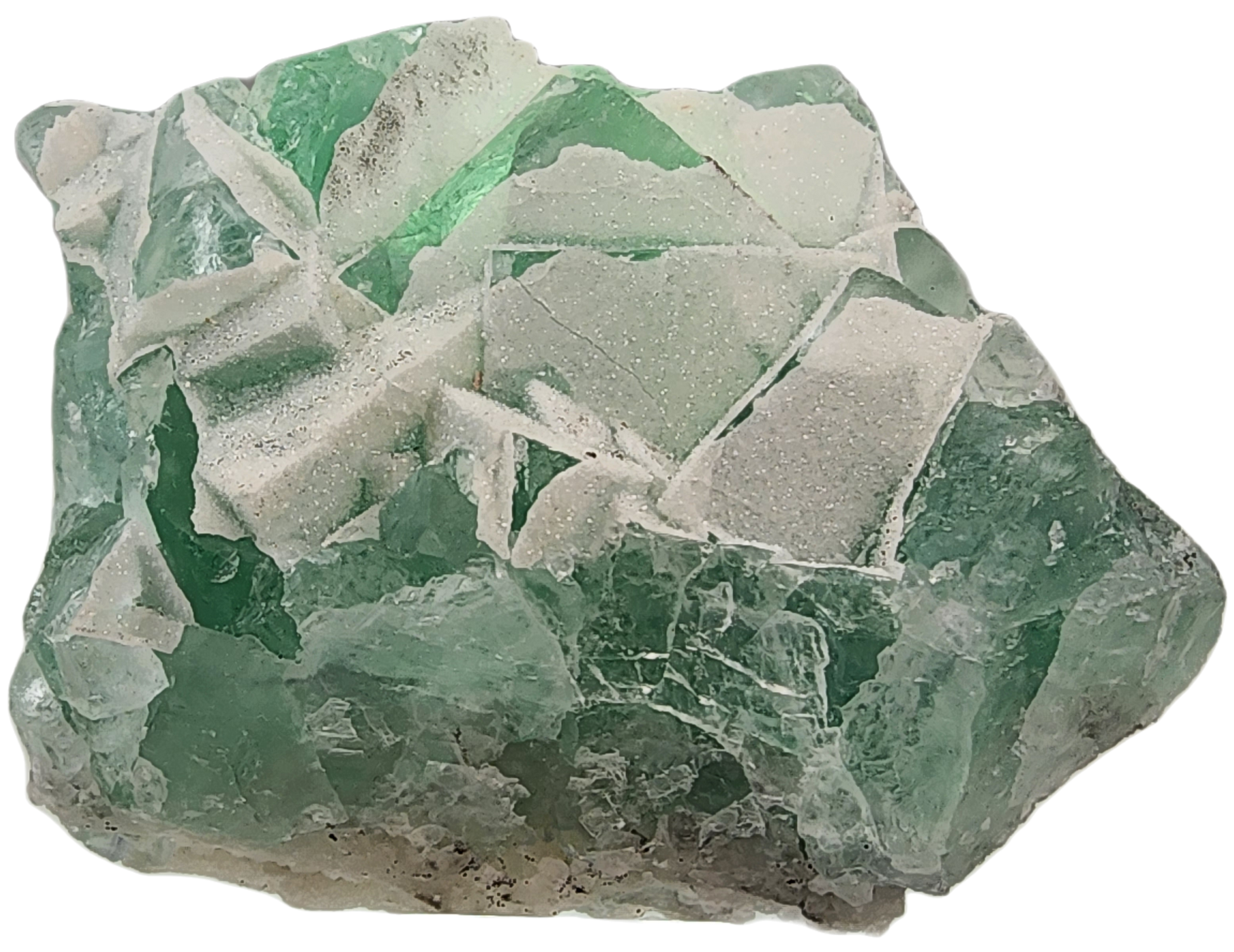 A close-up image of the "Fluorite-Yaogangxian with Micro 'Sugar' Quartz" mineral specimen from The Crystalary, showcasing its translucent seafoam green hue and irregular angular surfaces. The crystalline structure displays varying shades of green, with some lighter or nearly white areas due to internal fractures and reflections.