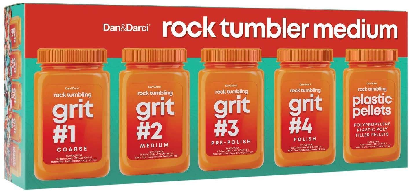 Image of a Dan&Darci Grit Refill kit featuring five orange containers labeled: grit #1 (coarse), grit #2 (medium), grit #3 (pre-polish), grit #4 (polish), and plastic pellets—perfect for those looking to create gems with ease or needing refill bottles for their rock polishing projects.