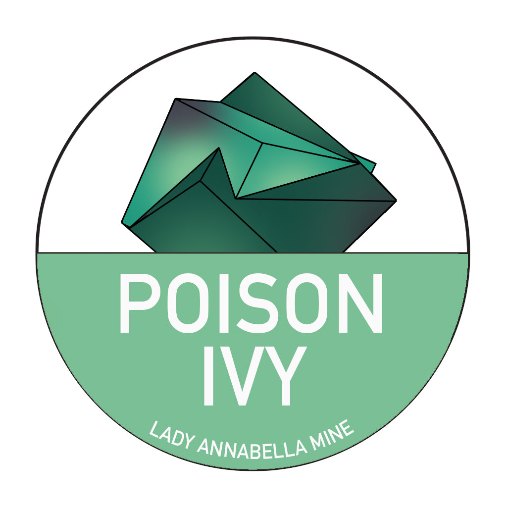 A logo featuring a geometric green gemstone above the words "POISON IVY" in bold, white capital letters on a green background. Below "POISON IVY," the text "LADY ANNABELLA MINE" is written in smaller white capital letters. This full-color design is part of The Crystalary's Lady Annabella Passport Stickers collection and is enclosed in a circle like a Fluorite Passport stamp.