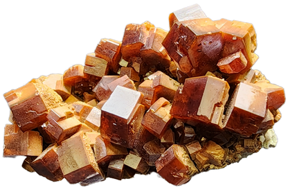 A close-up view of the Vanadinite from The Crystalary, sourced from the Mibladen mining district in Midelt Province, Drâa-Tafilalet Region, Morocco (sku 3076). This piece showcases a cluster of reddish-brown crystals with rectangular shapes, layered to reveal a shiny and reflective surface. The image emphasizes the intricate geometric patterns and textures of this stunning mineral specimen.